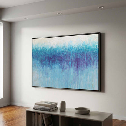 Abstract Blue Gradient Canvas Wall Art – canvas print shown framed in a styled room