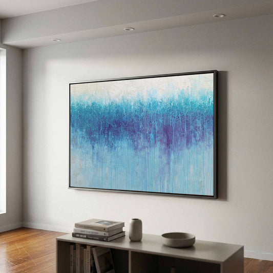 Abstract Blue Gradient Canvas Wall Art – canvas print shown framed in a styled room